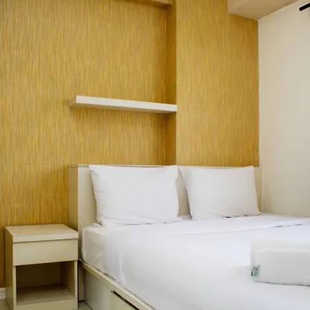 Minimalist And Warm 2Br Bassura City Apartment By Travelio
